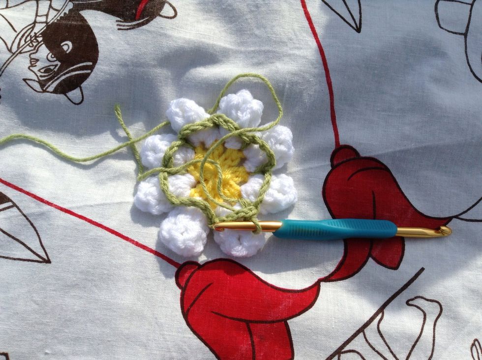 Sl st into the next green ch-4 loop.