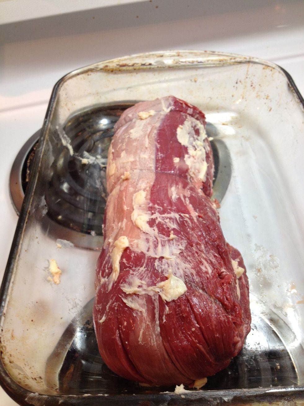 Slather the 2 TBSP of softened butter alllllll over the beef tenderloin and place in a glass pan.