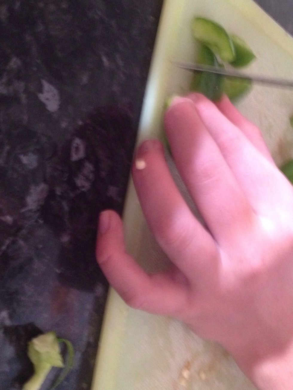 Slice 1/3 of the capsicum off. Core the capsicum then take all the seeds out. Dice capsicum into cubes. Place into the bowl.