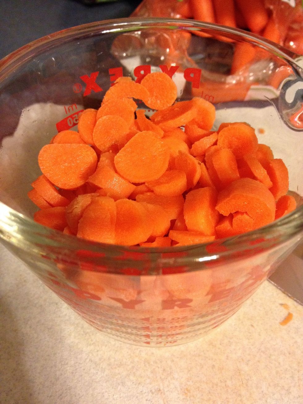 Slice 1 cup of carrots; chop 1 cup of celery; mince two cloves of garlic; and chop 1/2 of a large white onion. Add to crock pot.