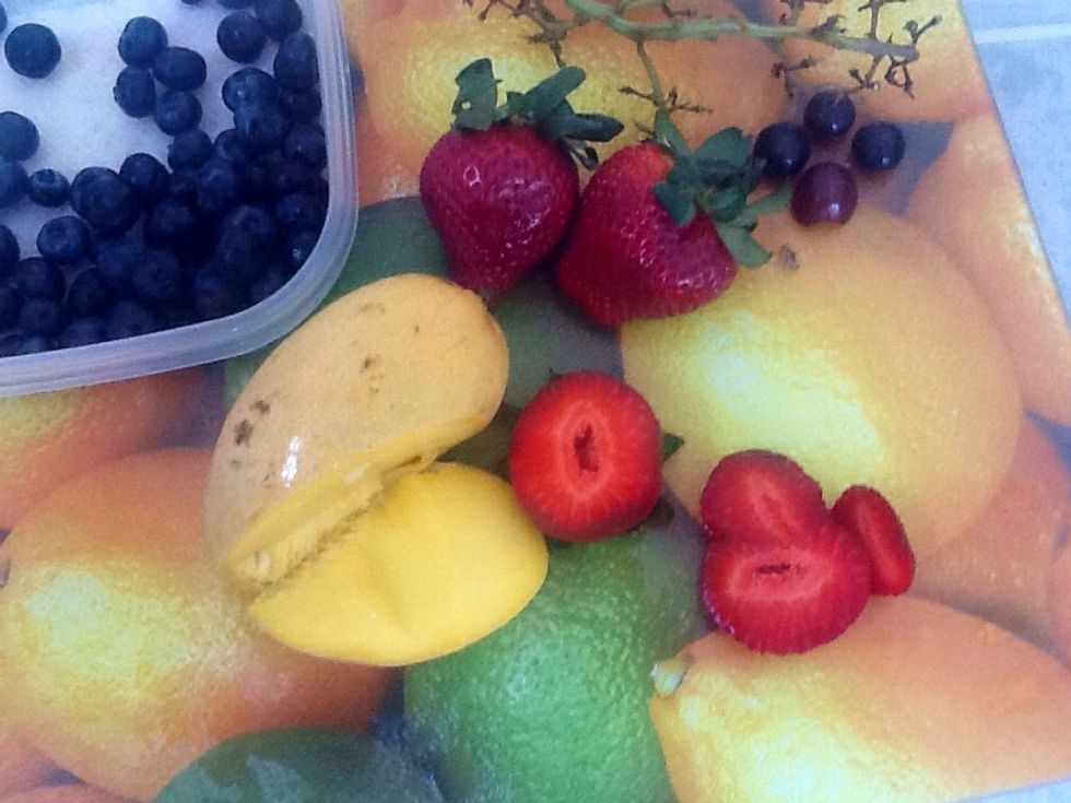 Slice 2cups worth or your favorite fruit and berries. I've chosen strawberries, blueberries, mango, kiwi, blackberries and grapes but this step is entirely customizable.