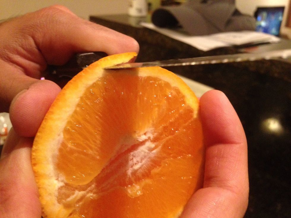 Slice a thin peel off the orange like so...you want to just dissect the peel