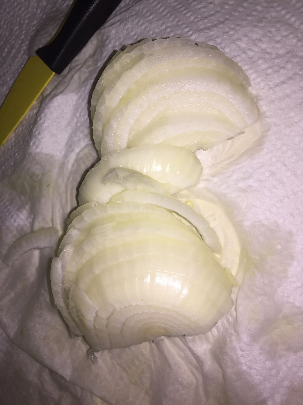 Slice a Vidalia onion.