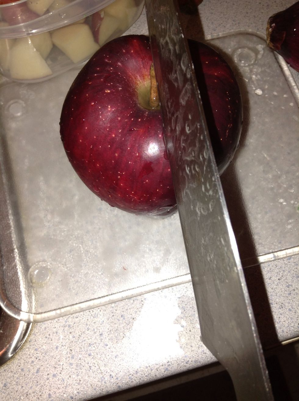 Slice an apple into half and core one half. Put the other half away ( or eat it... Up to you )