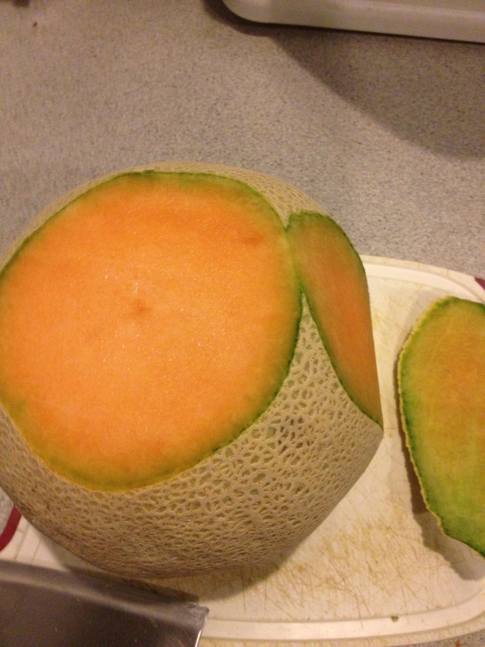 Slice away the skin by cutting into it with a vertical motion using a knife