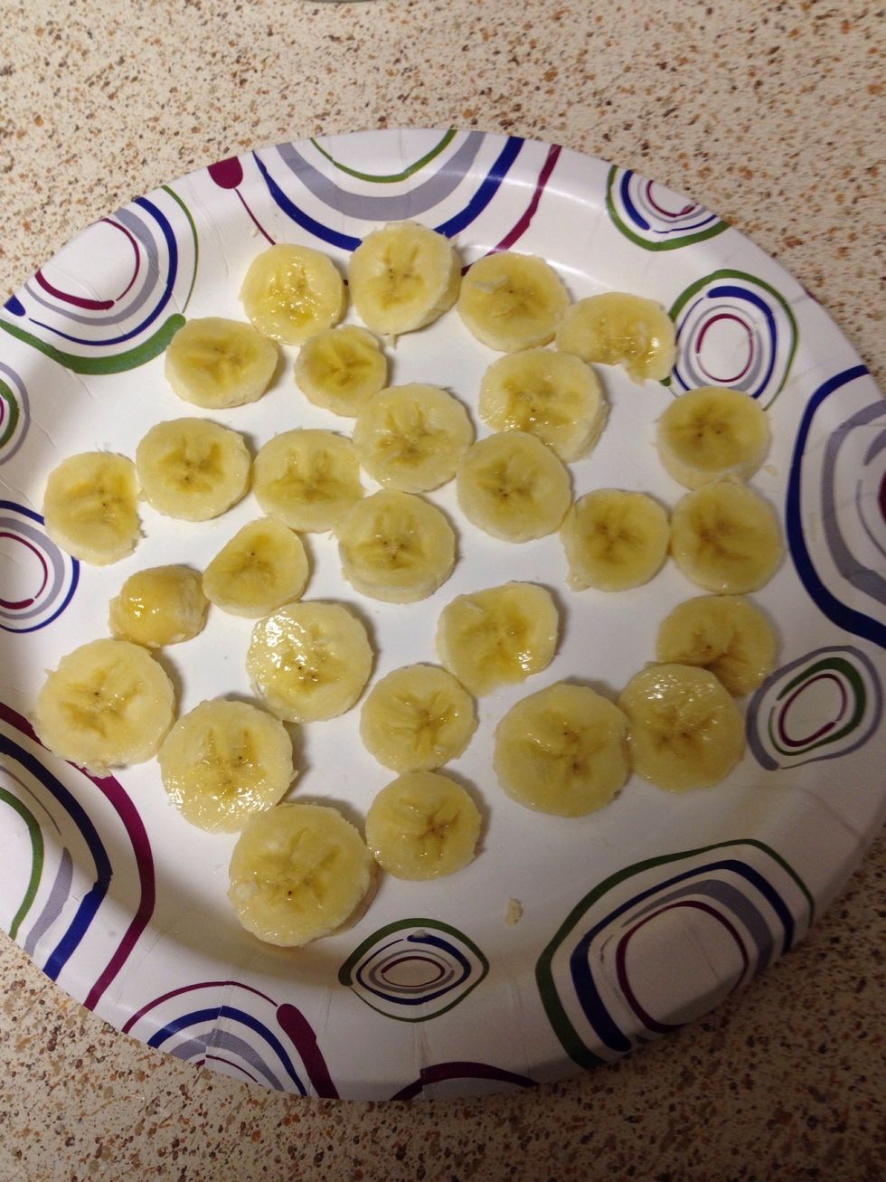 Slice bananas. The thinner the slice the quicker it will freeze.