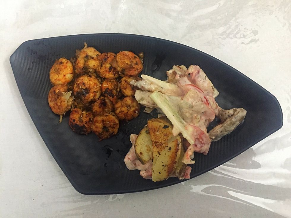 Slice boiled potatoes, tomato and cucumber. Mix with mayonnaise, tartar sauce,cheese spread and salt to prepare salad.