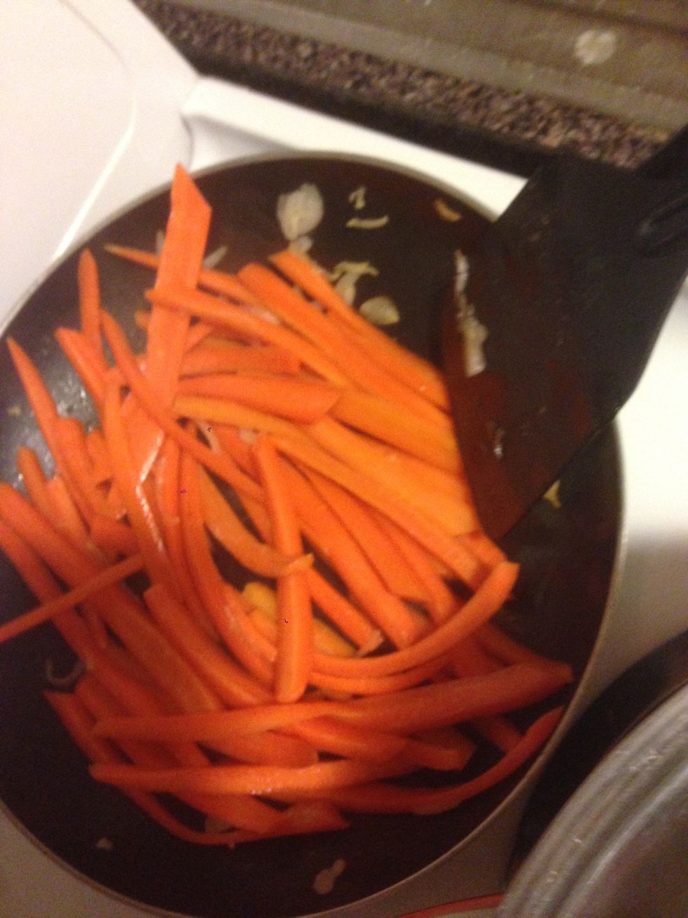Slice carrots in length, brown it with oil and garlic for 5min, season and add half-cup of water, cover and stew for 10 -15 min at medium temp with fresh sage leaves. In the same time boil pasta.
