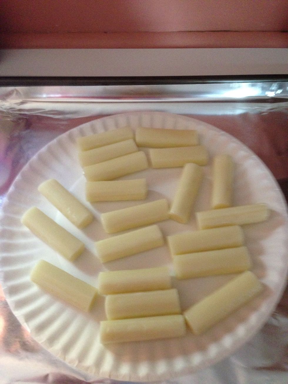 Slice cheese sticks into halves.  I made way more than 8!