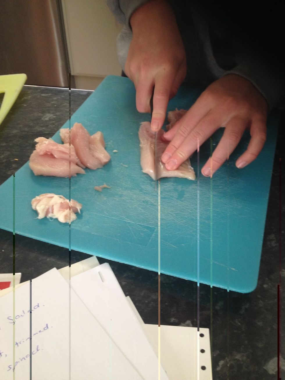 Slice chicken into strips then wash hands thoroughly.