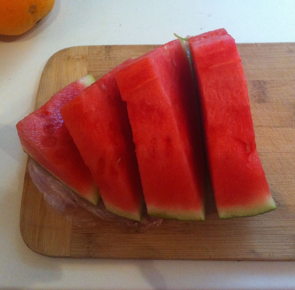 Slice chunk of watermelon into thick slices
