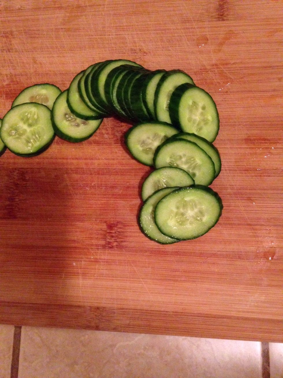 Slice cucumber for later.