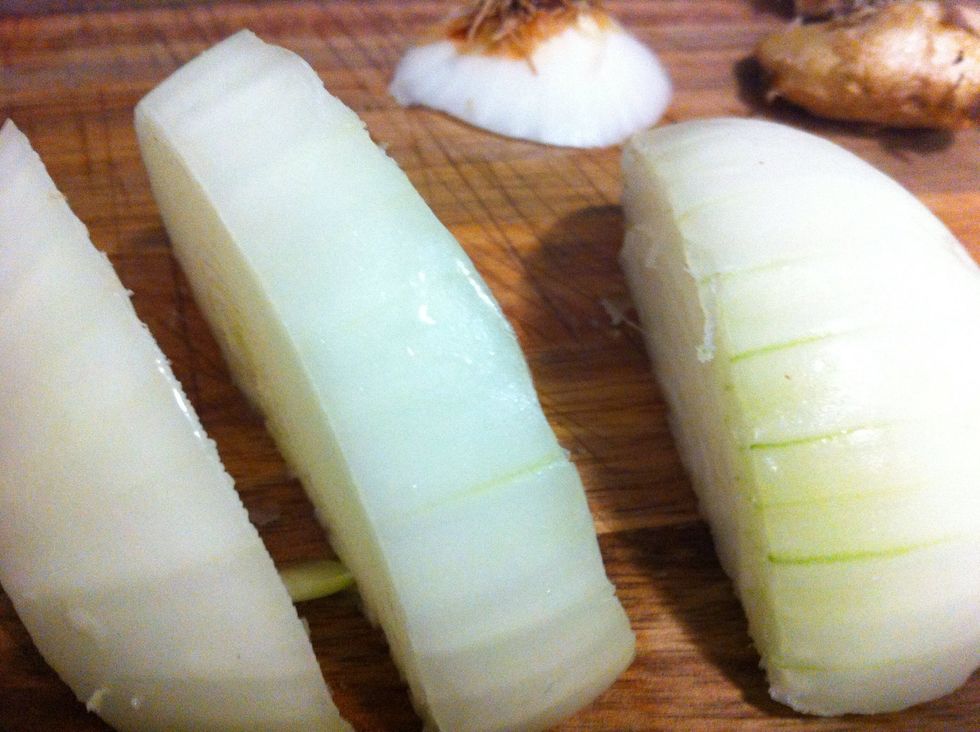 Slice down the middle, then each half in half - then cube