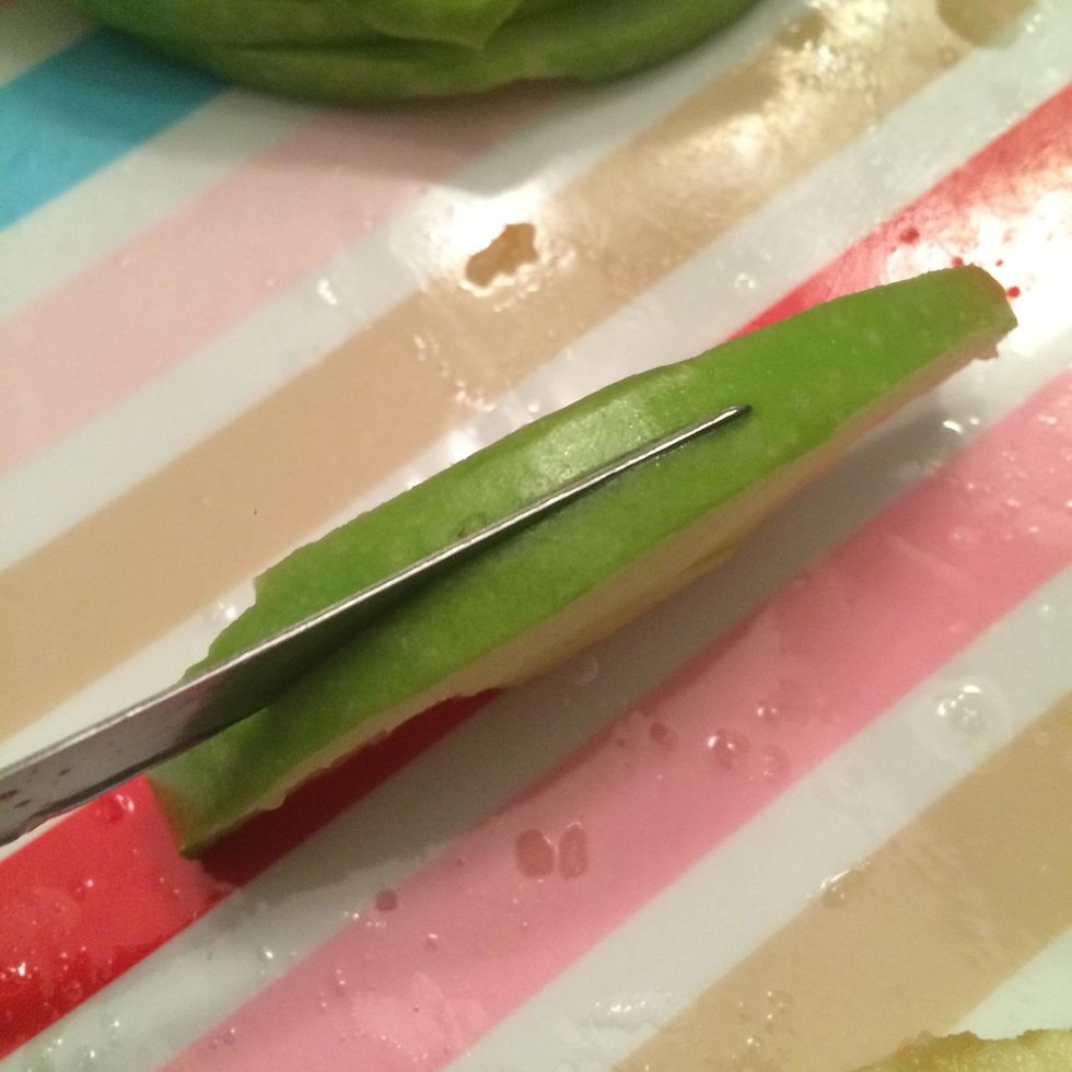 Slice each apple in half once again. Now you should have apple slices that are 1/4 of the original slice.