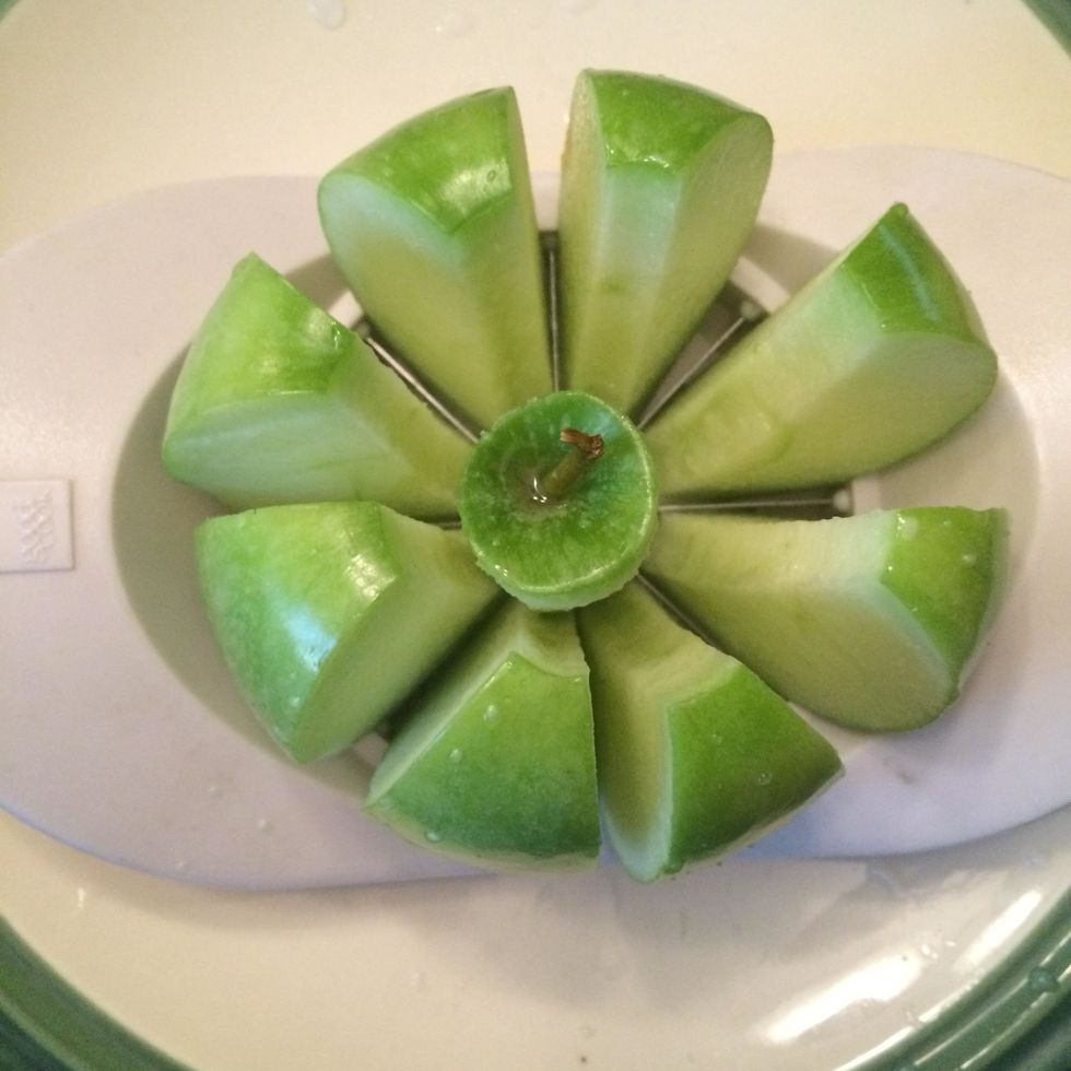 Slice each apple with an apple slicer.