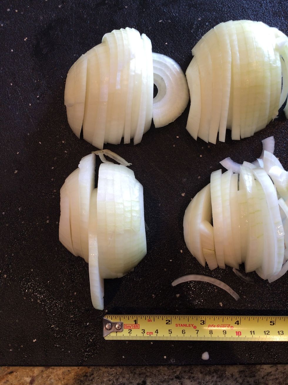 Slice each half crosswise in 1/4 inch thick slices.