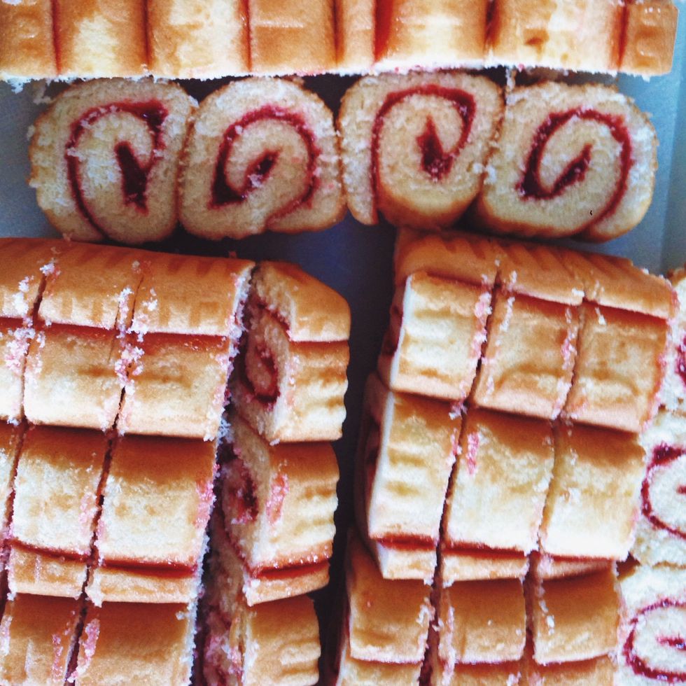 Slice each jelly roll into equal parts. You'll need lots of pieces to create multiple layers for the trifle.