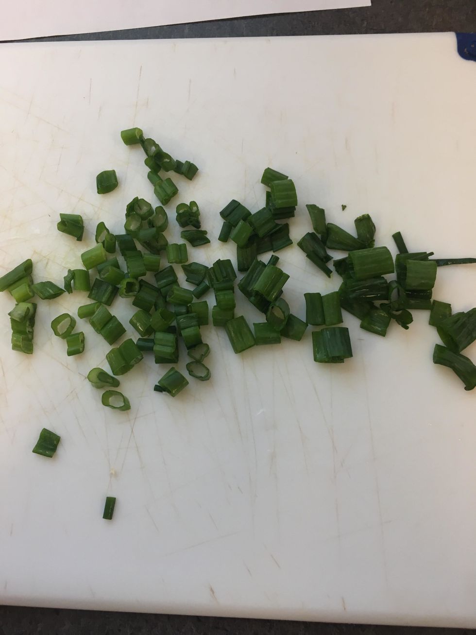 slice either part of the spring onion for which ever taste you would like for this we choose the leaf half instead of the stock part