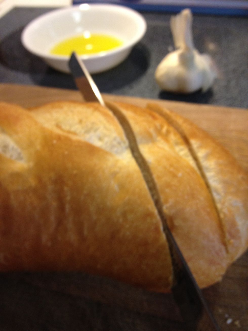 Slice into your loaf of sour dough French bread at an angle for larger surface area .