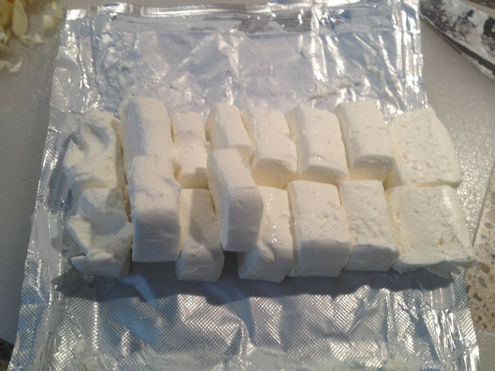 Slice it in half long ways and then chop into cubes.