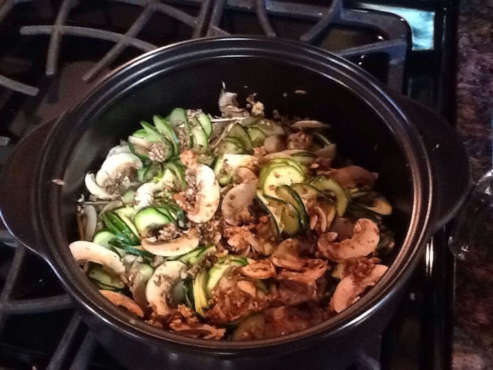 Slice, julienne, chop or Spiral slice your zucchini into the Dutch Oven Rockcrok (or similar 4 Qt+ vessel). Add mushrooms, black pepper, Bell Pepper & Herb Rub or any other desired seasonings.