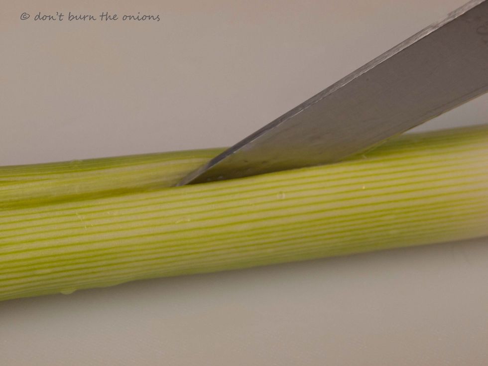 Slice leek in half.