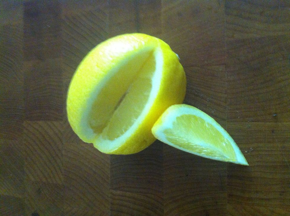Slice lemon small enough to fit in bottle opening.