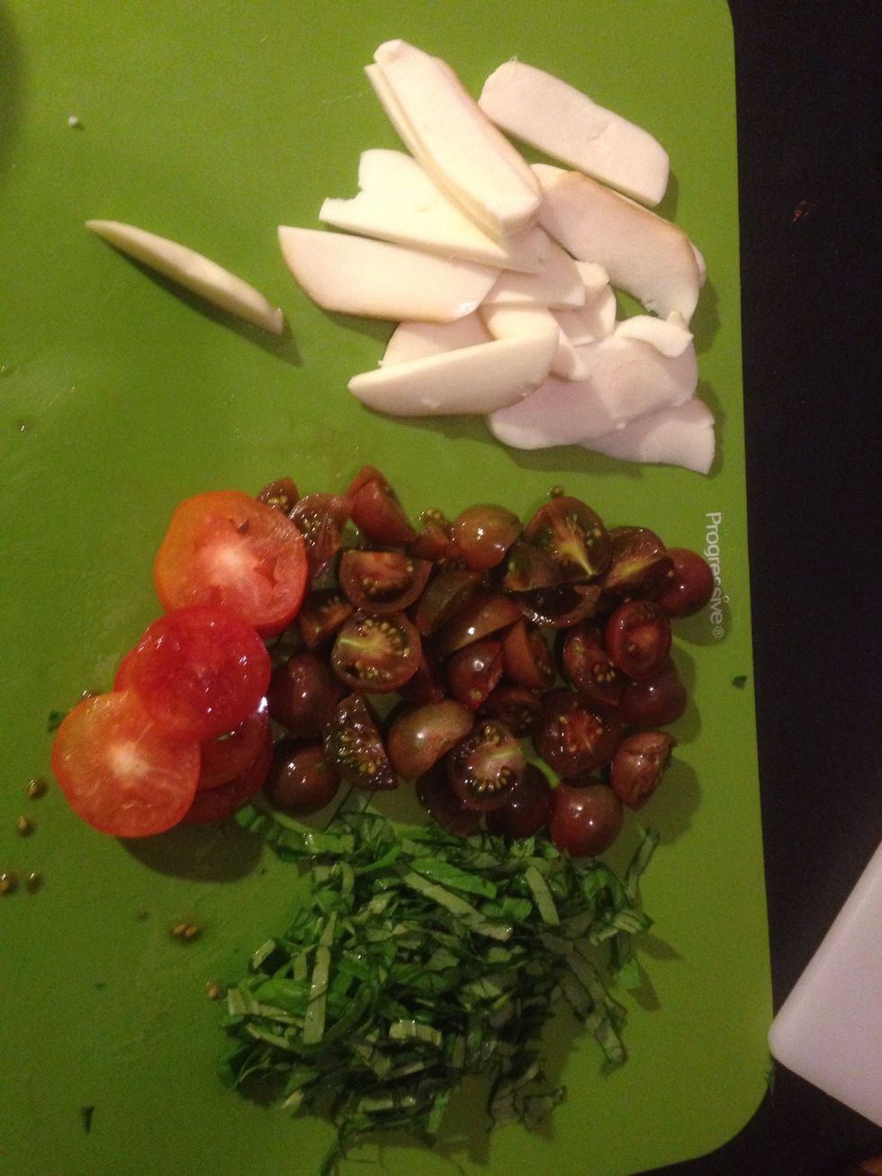 Slice mozzarella, tomatoes, cut up basil if you would like.
