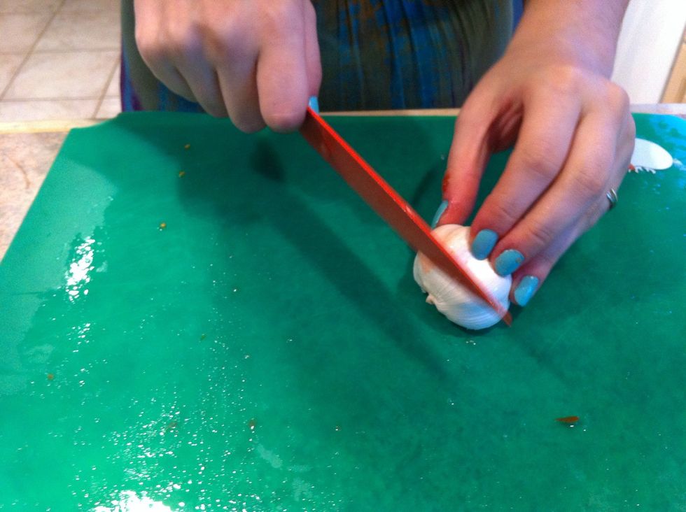 Slice off the ends of the garlic