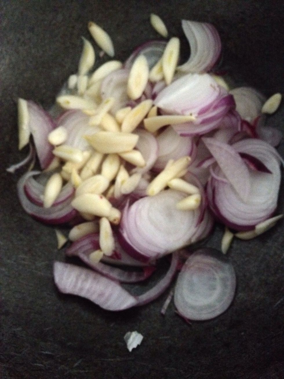 Slice onions and garlic finely and cook. Take 1 teaspoon butter and one teaspoon oil in pan and add the onions and garlic . Put your gas on very low heat and let it cook slowly .