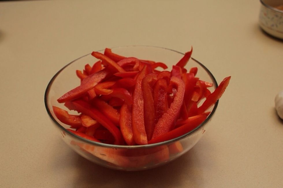 Slice red bell peppers into stripes