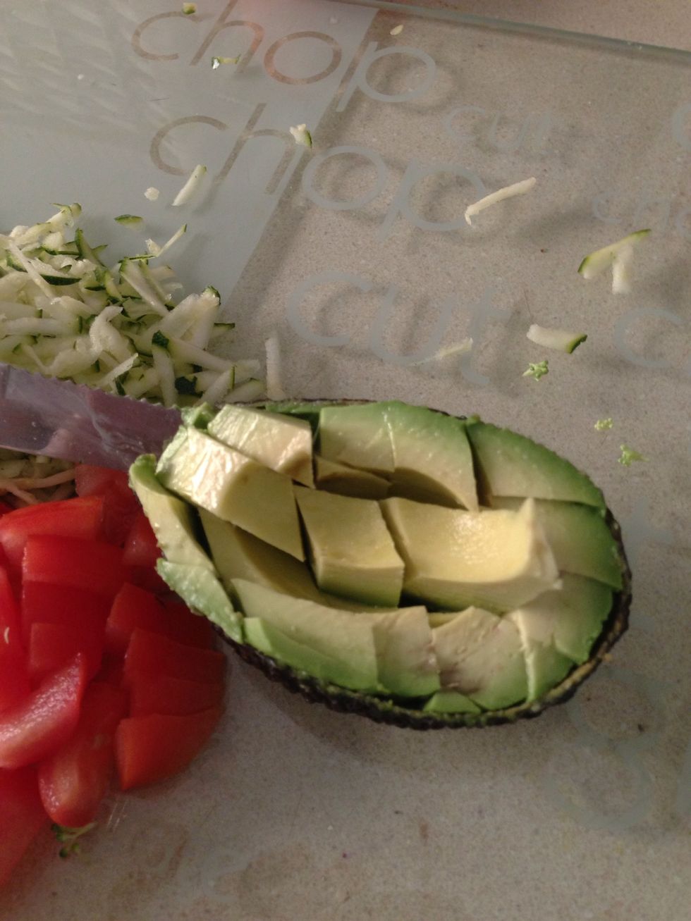 Slice some avocado into cubes while its still in the shell .. So you don't have to get slimy avocado fingers..!