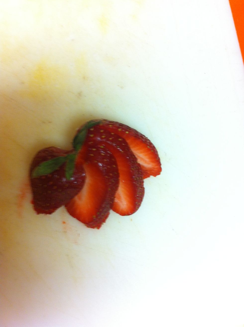 Slice strawberry and fan as pictured.