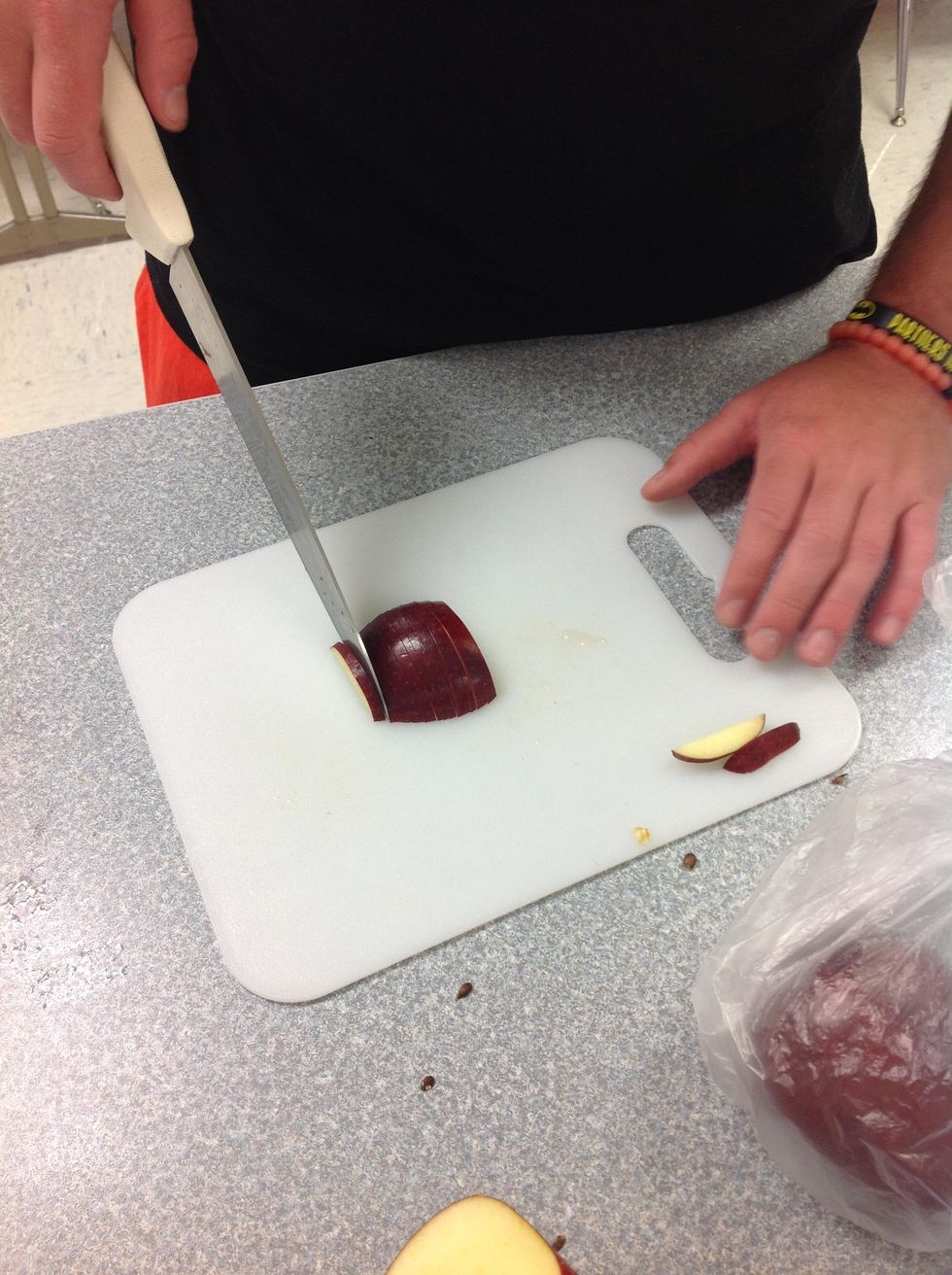 Slice the apple into 1mm thick slices. Make sure to keep the slices together