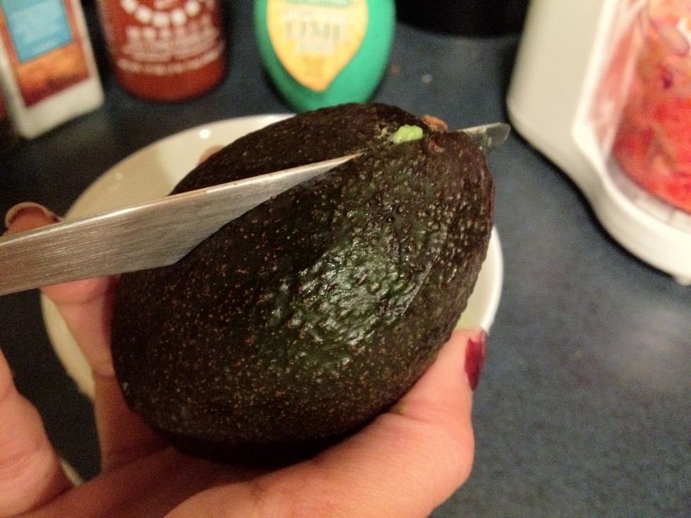Slice the avocados in half. I find it's best to cut down to the seed and work the knife around until the two halves twist apart easily