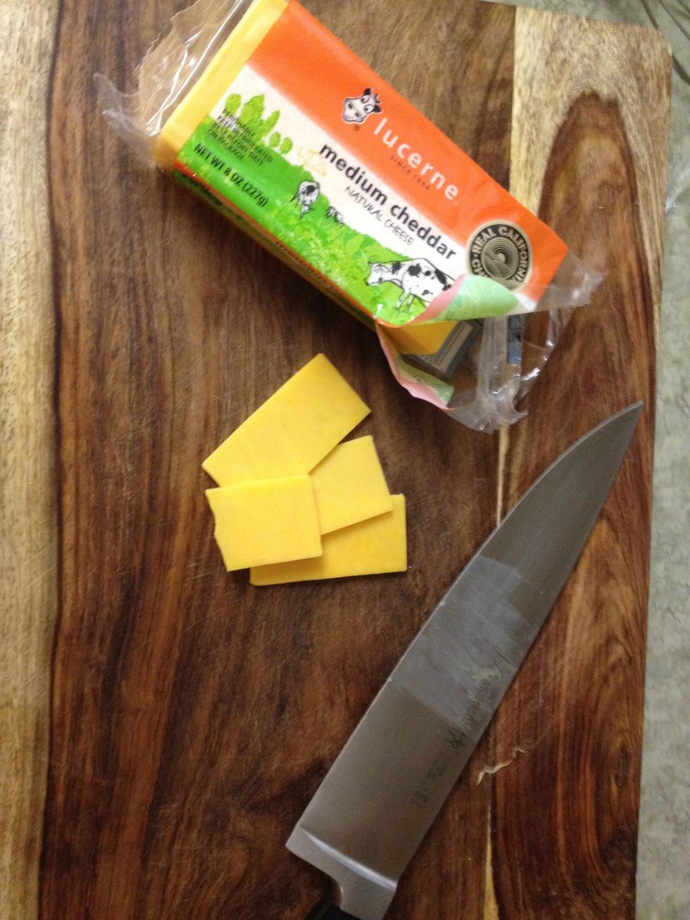 slice the cheddar cheese.