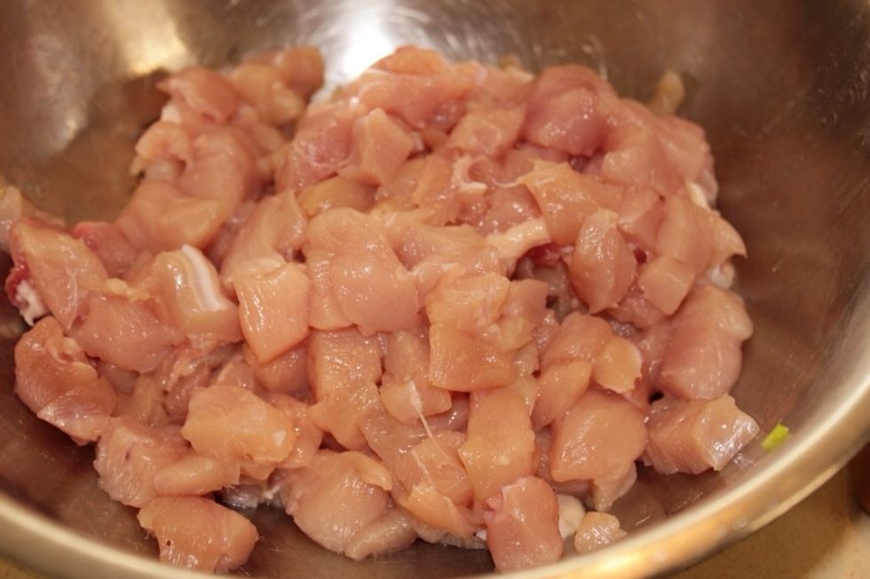 Slice the chicken breast into the smallest cubes you can manage. It might be easier to cut it after pre-cooking it, but you can also cut it raw.