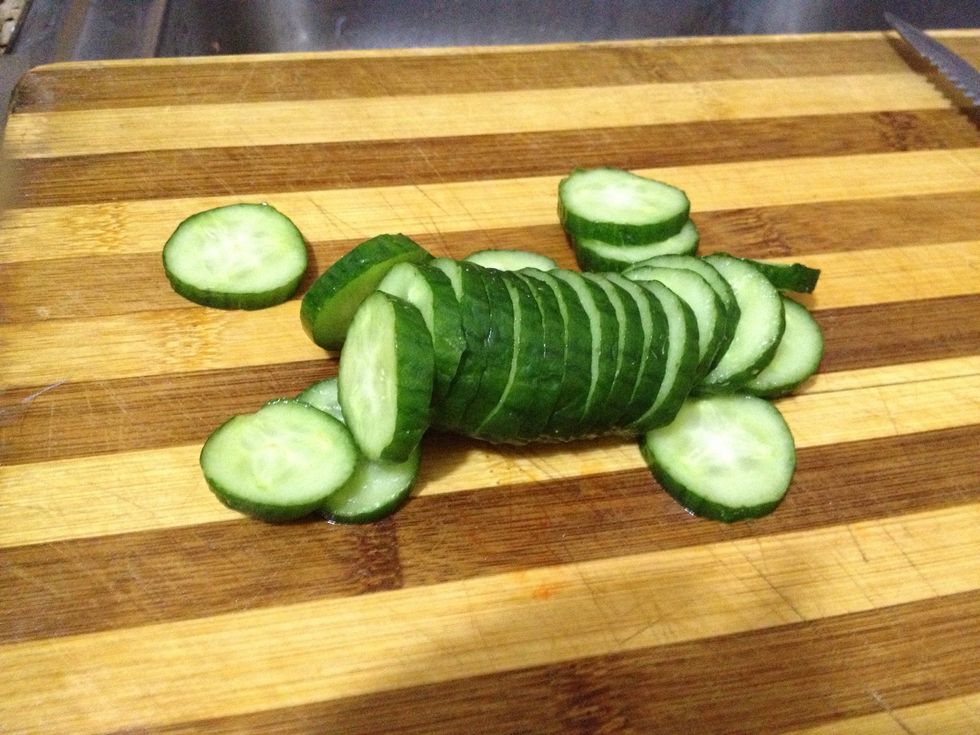 Slice the cucumber for decorating the plate