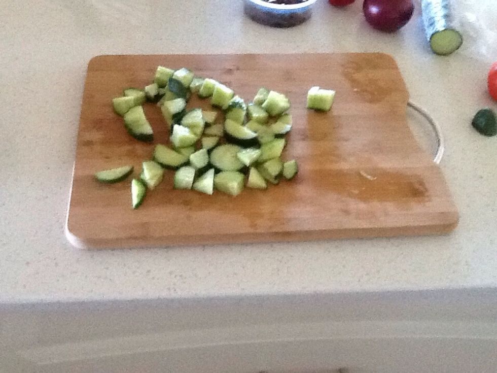 Slice the cucumber into quarters