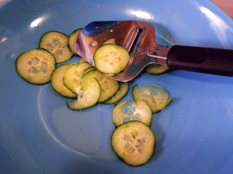 Slice the cucumber thin.