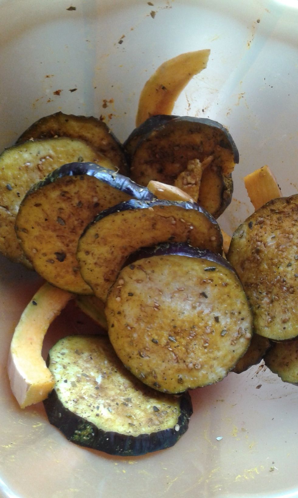 Slice the eggplant about a quarter inch thick or thinner. Place in bowl and add all the seasonings. Add some mix and then add more til the pieces are well coated.