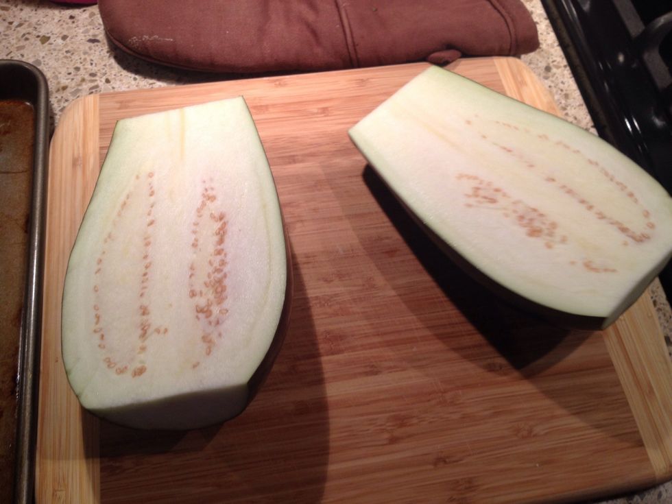 Slice the eggplant in half.