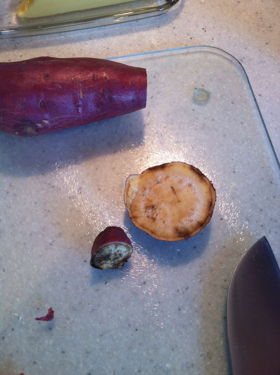Slice the ends off of the sweet potato.