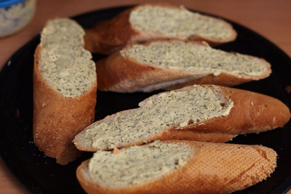 Slice the French baguette bread into thick chunky manly sized slices lol. Using the Tuscan butter mix, butter the bread on both sides. Don't bake until your chicken in almost ready.
