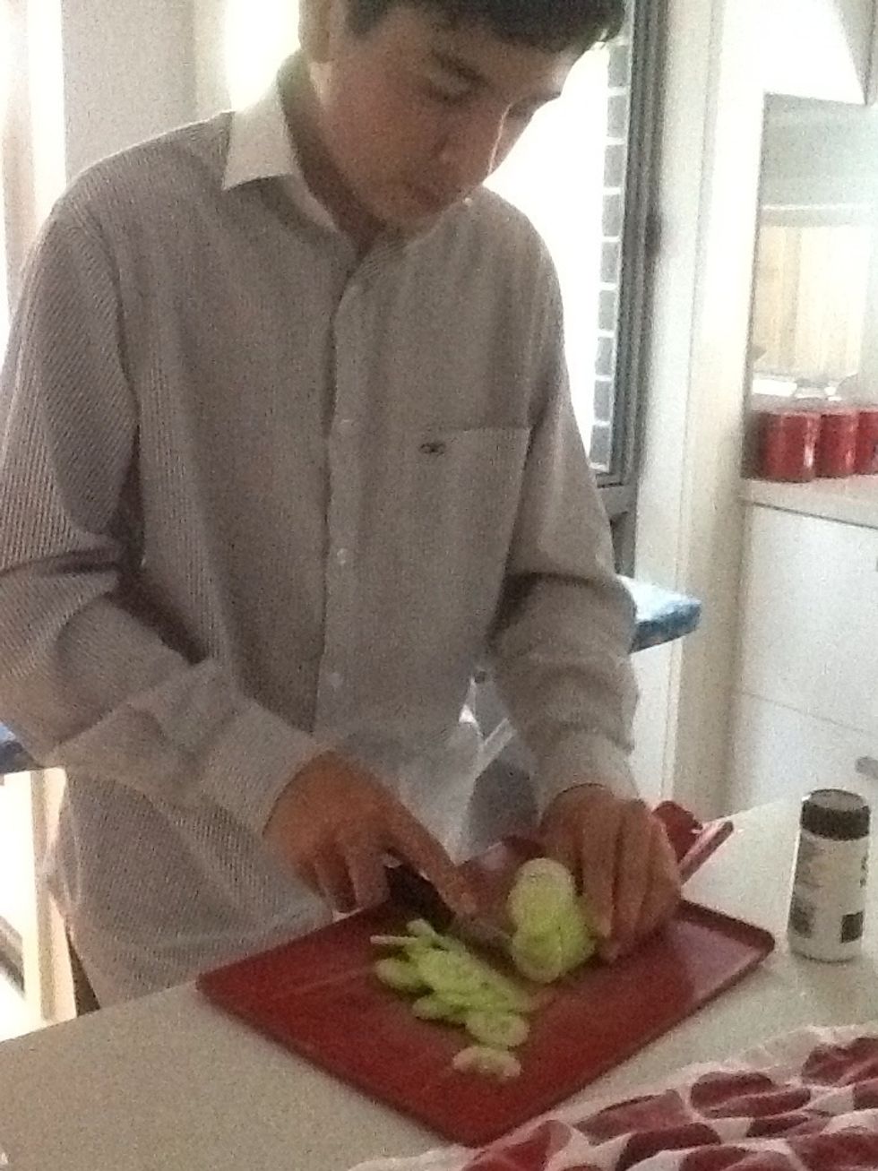 Slice the Lebanese cucumber into fine pieces. Also take the pasta off the boil and strain the water out.