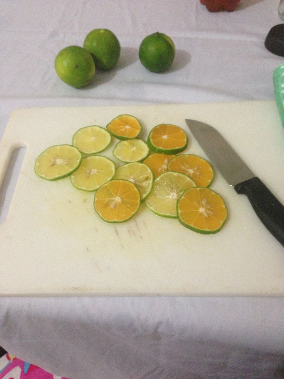 Slice the lemons (limes) in to thin slices