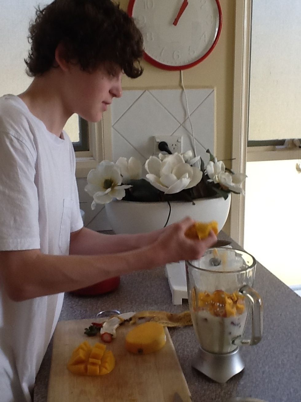 Slice the mango into the blender (the last fruit in the mixture!)