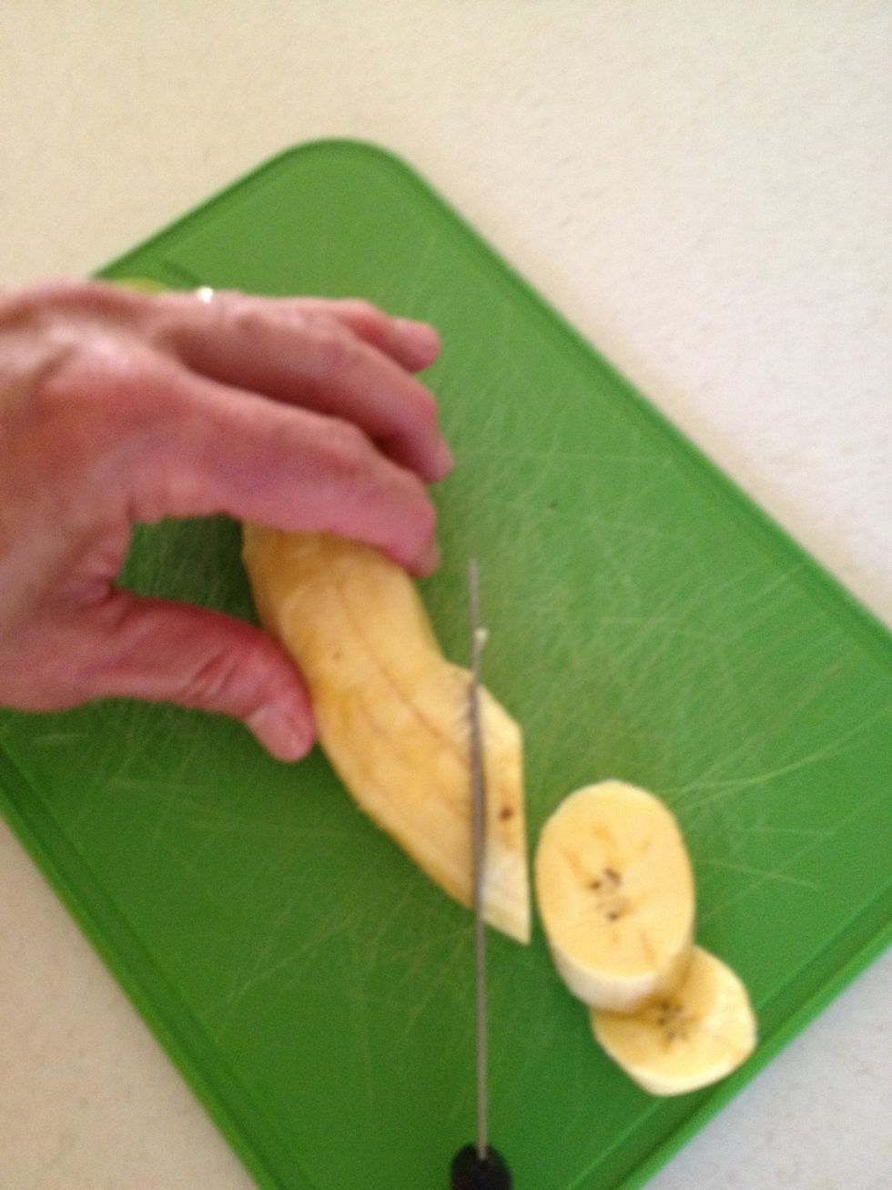 Slice the peeled plantain at an angles so it will be easier to grab with the tongs.