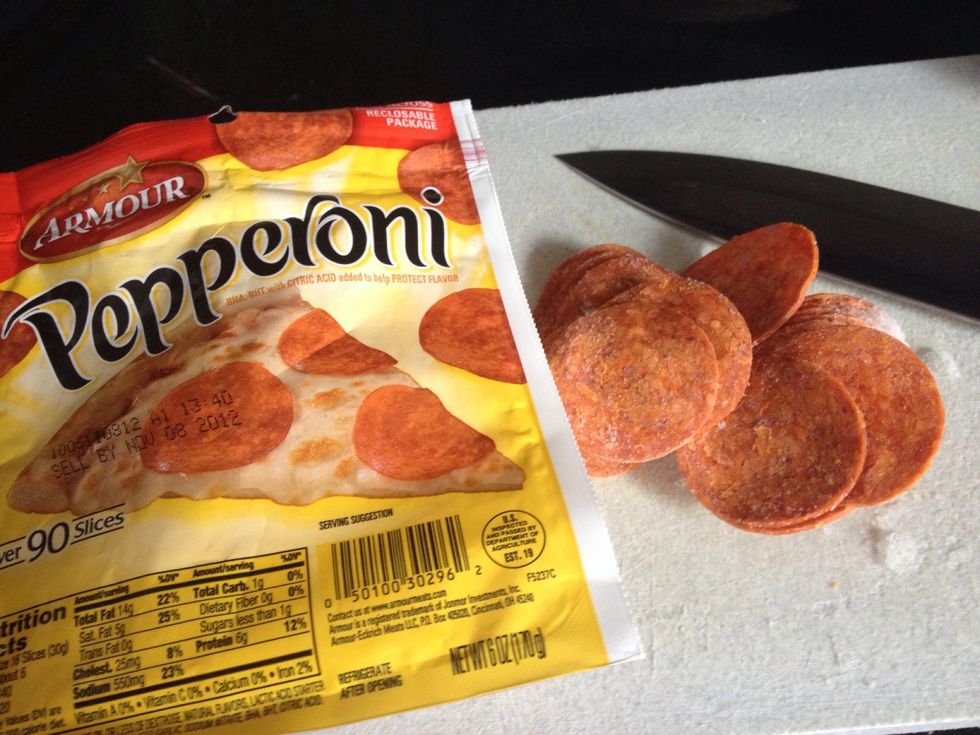 Slice the pepperoni into quarters, then add to the meat, onion, & pepper mixture.