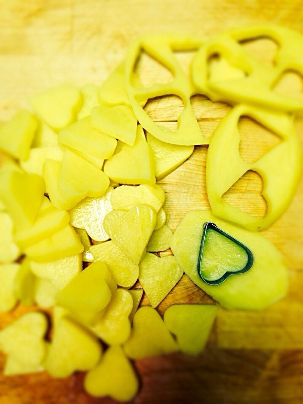 Slice the potatoes and cut heart shapes with small cookie cutter